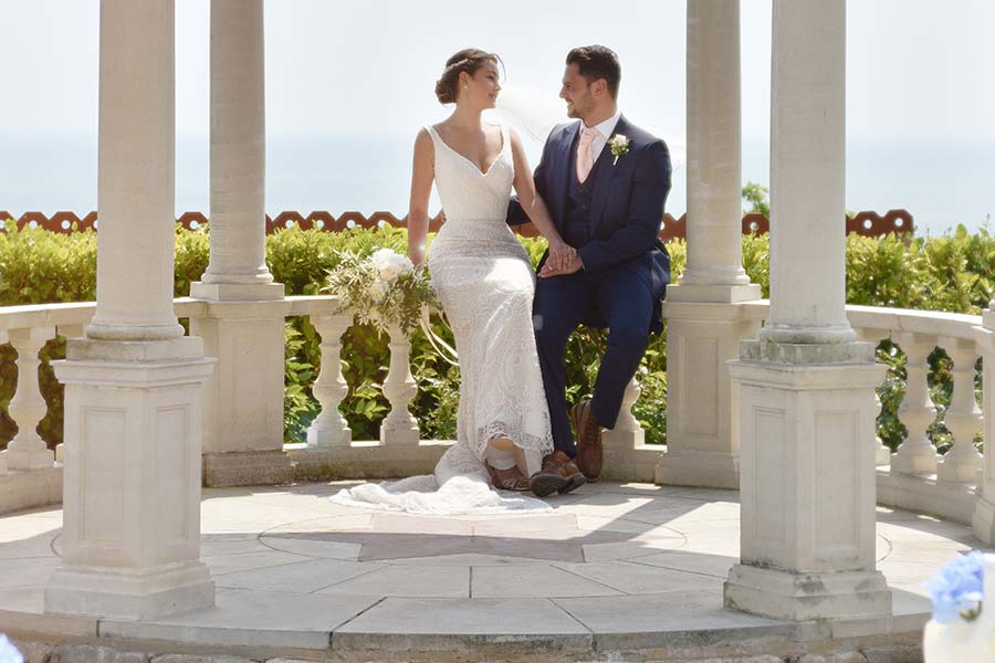 Bride & Grooming seated on the Coastal Terrace