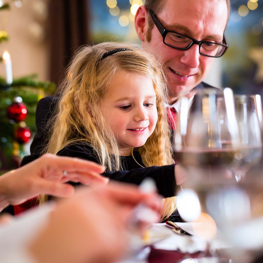 Father and daughter enjoying festive lunch