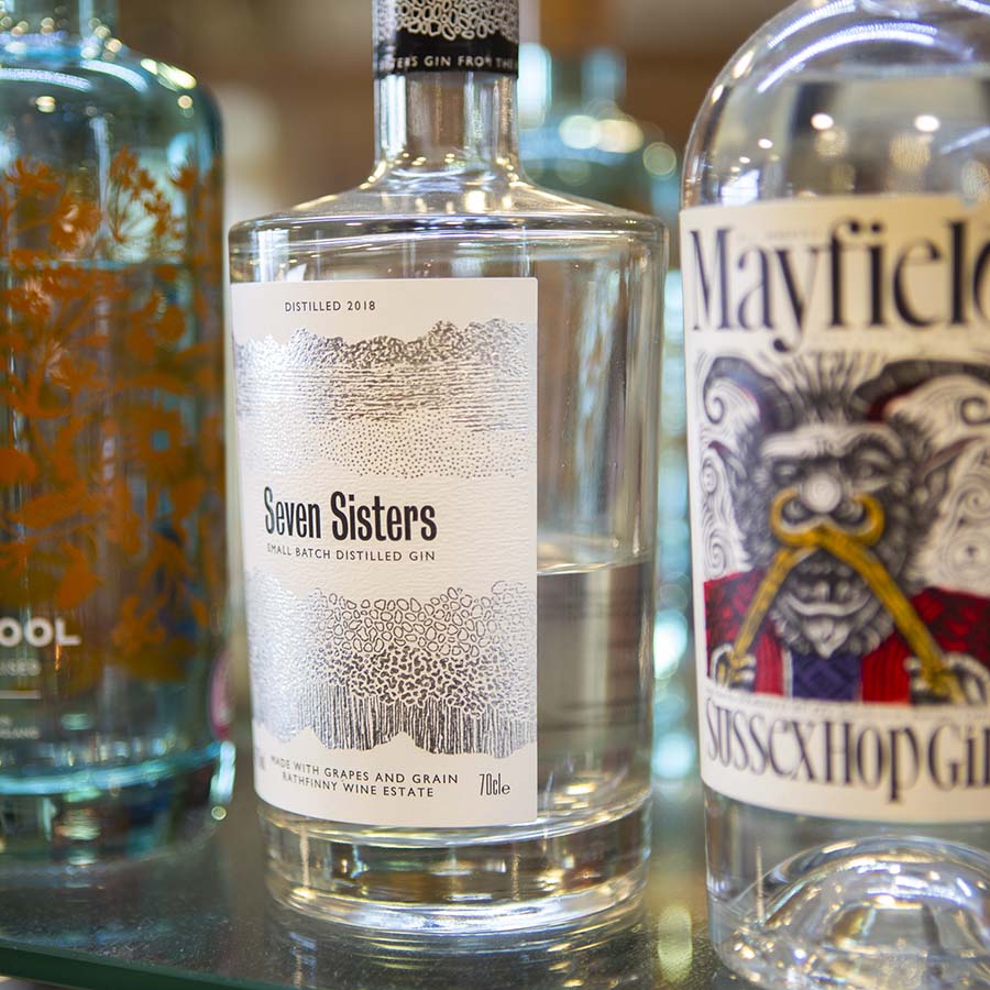 A selection of local gin bottles including Seven Sisters and Mayfield Gin