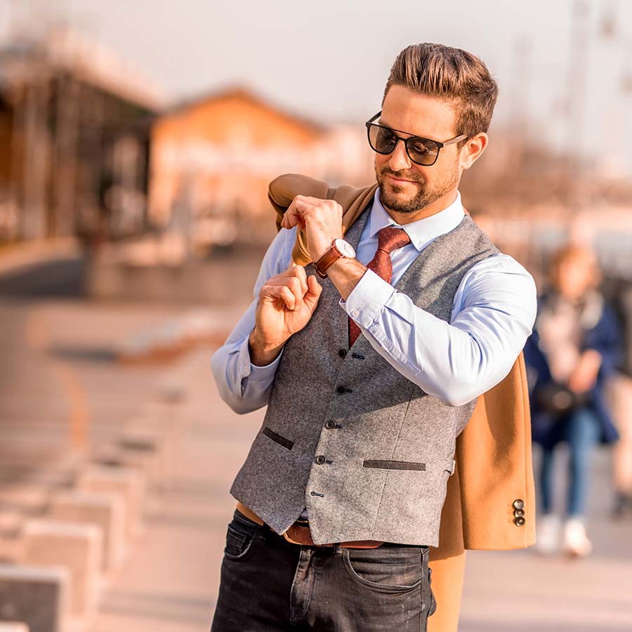 Man with blonde hair walking in the street