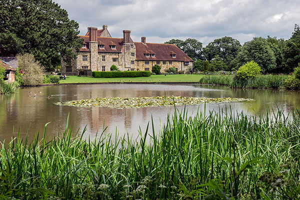 Exterior View across the lake of Michelham Priory