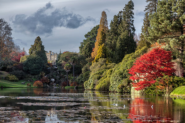 View of Sheffield Park House from the lake and gardens