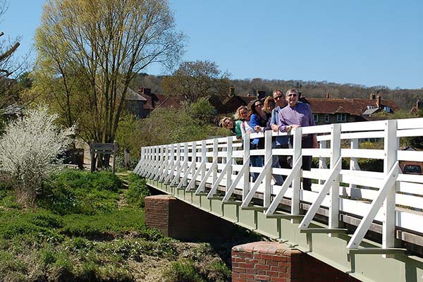 Walkers crossing The White Bridge at Alfriston