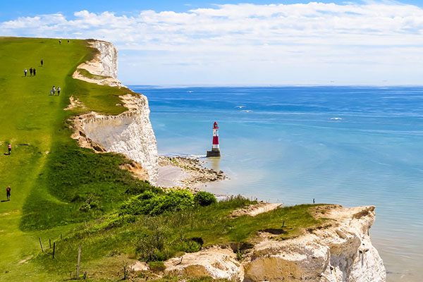 White chalk cliffs and aerial view of the Beachy Head Lighthouse, Eastbourne, East Sussex, England