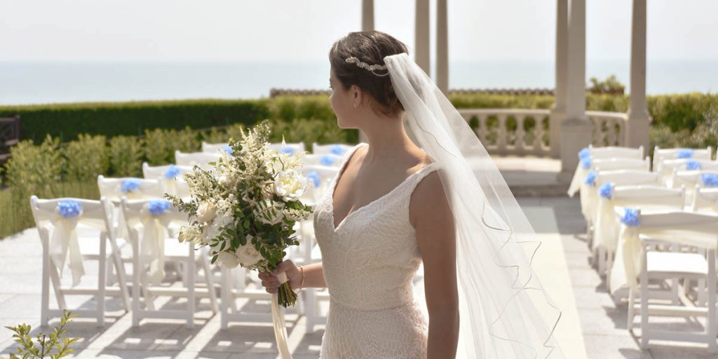 Bride holding wedding bouquet on the Coastal Terrace