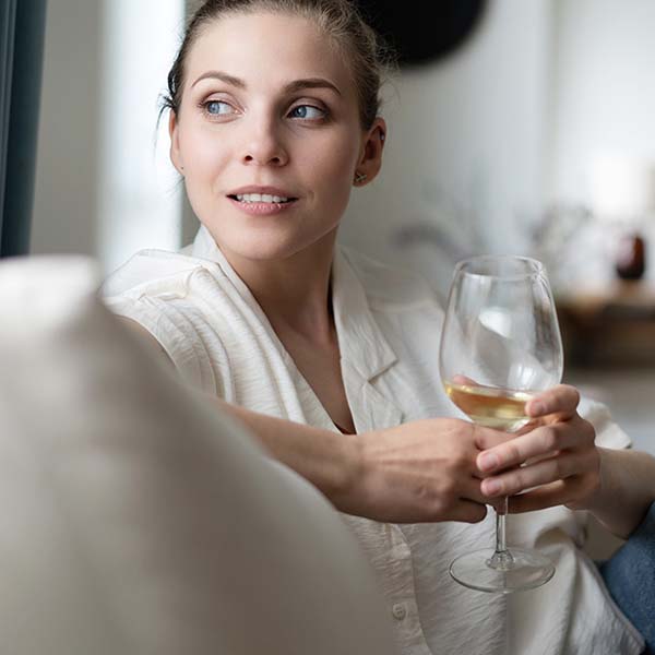 Lady holding wine glass at Hydro Hotel