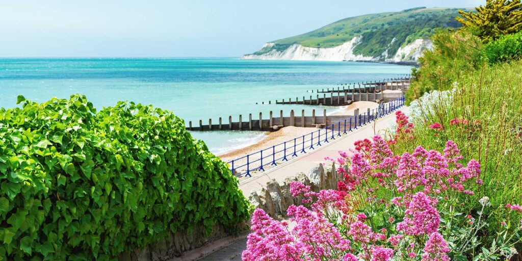 Walk to Holywell beach in Eastbourne, East Sussex, England, view of the sea, cliffs, groynes, selective focus